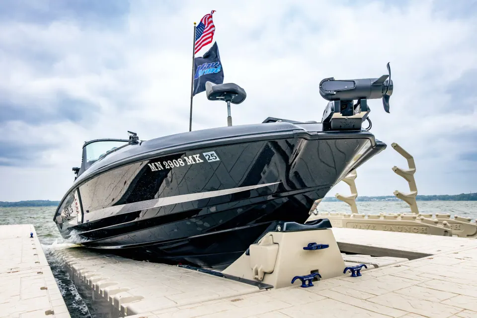 Wave Armor drive-on boat port Fishing boat supported on a Wave Armor drive-on boat port beside modular dock sections